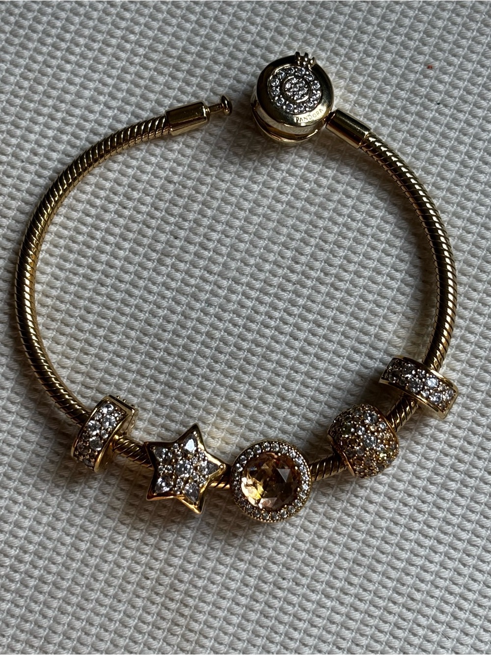 Pandora 14K yellow gold plated charm bracelet. Size 6.7